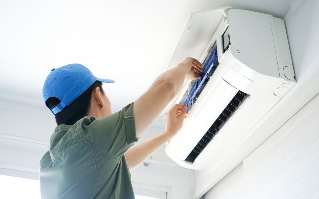 HVAC technician servicing a ductless mini split in Folsom