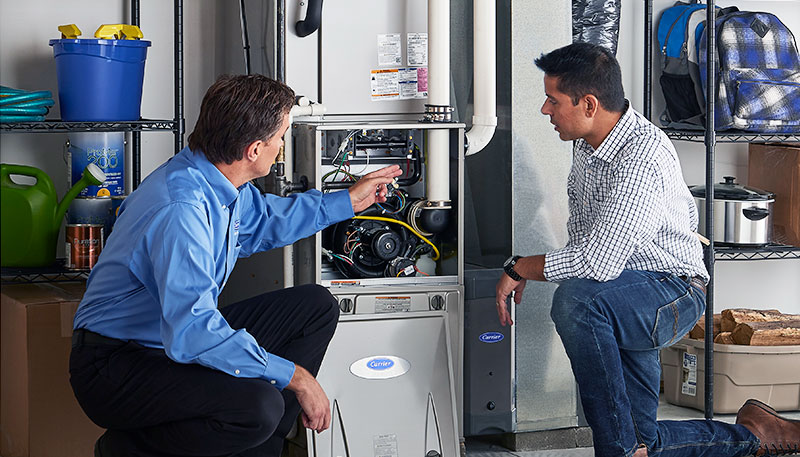 Technician evaluating a furnace for repair or replacement in Folsom