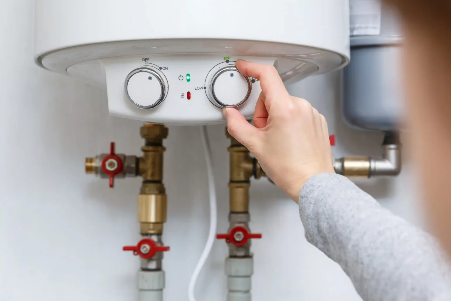 Technician adjusting a water heater in Folsom